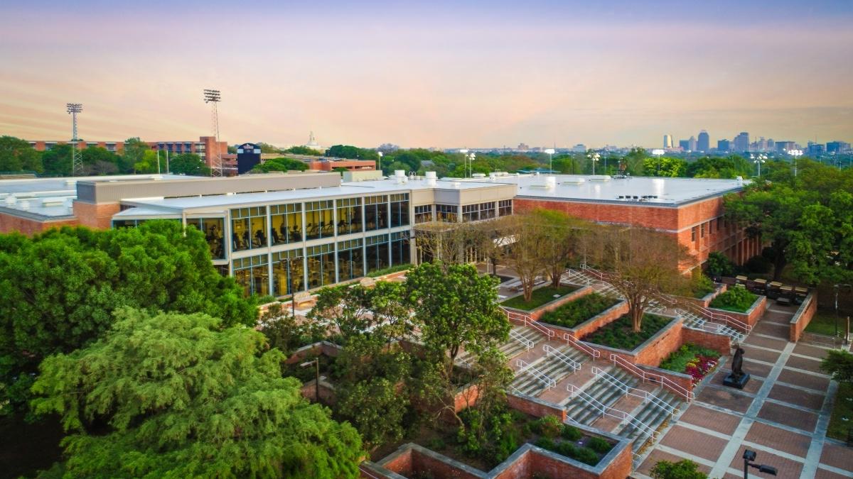 exterior drone shot of the Bell Center at sunset